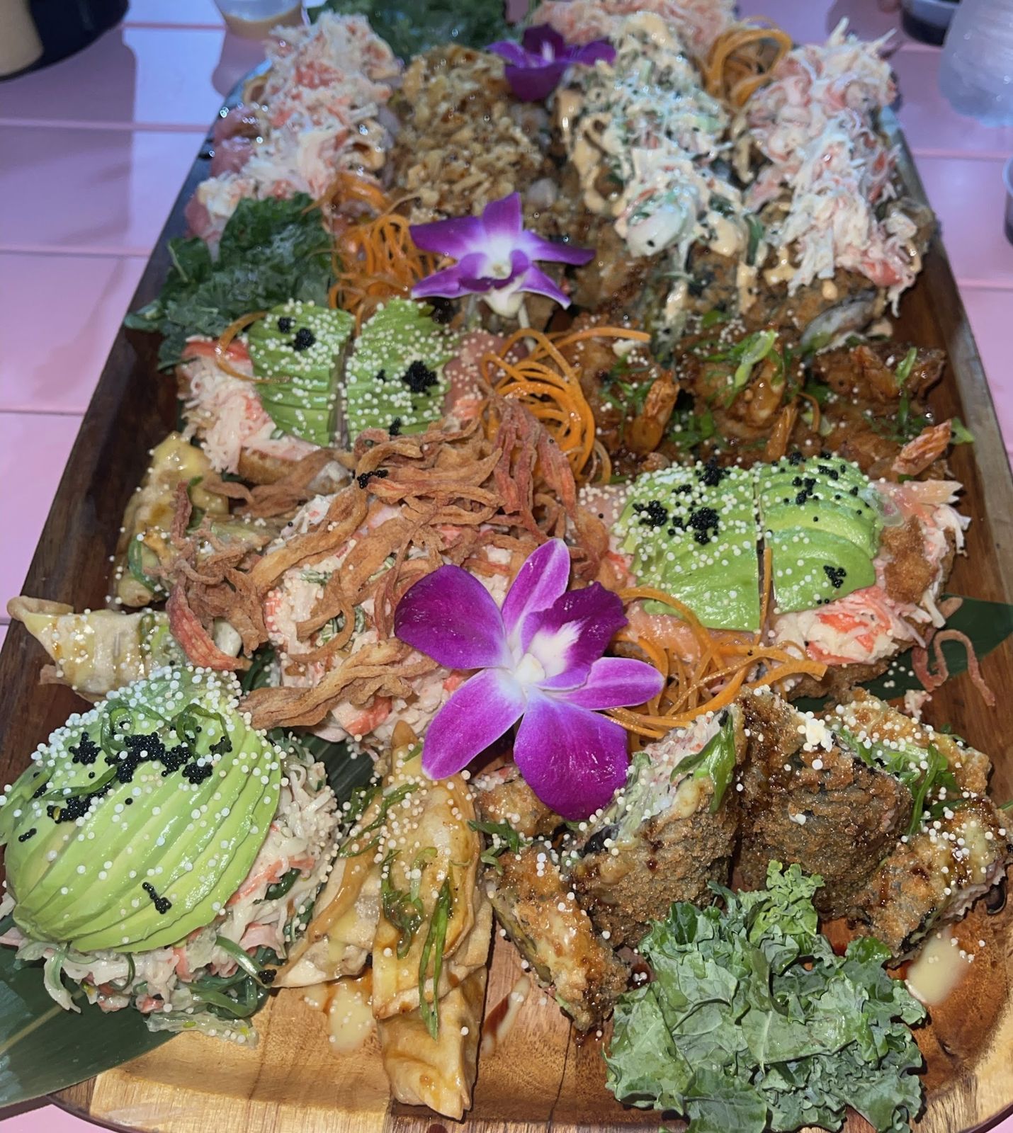 Large sushi boat with orchids