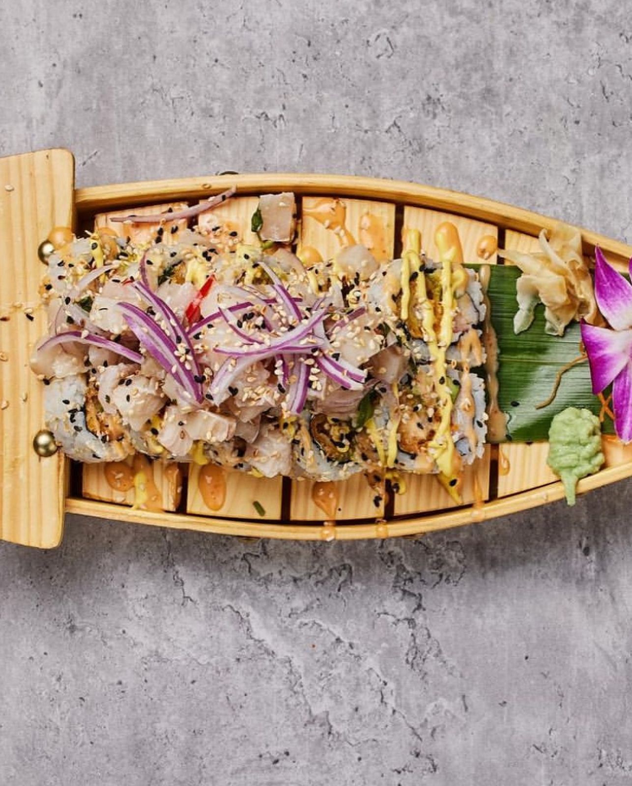 Temaki sushi boat with mixed rolls